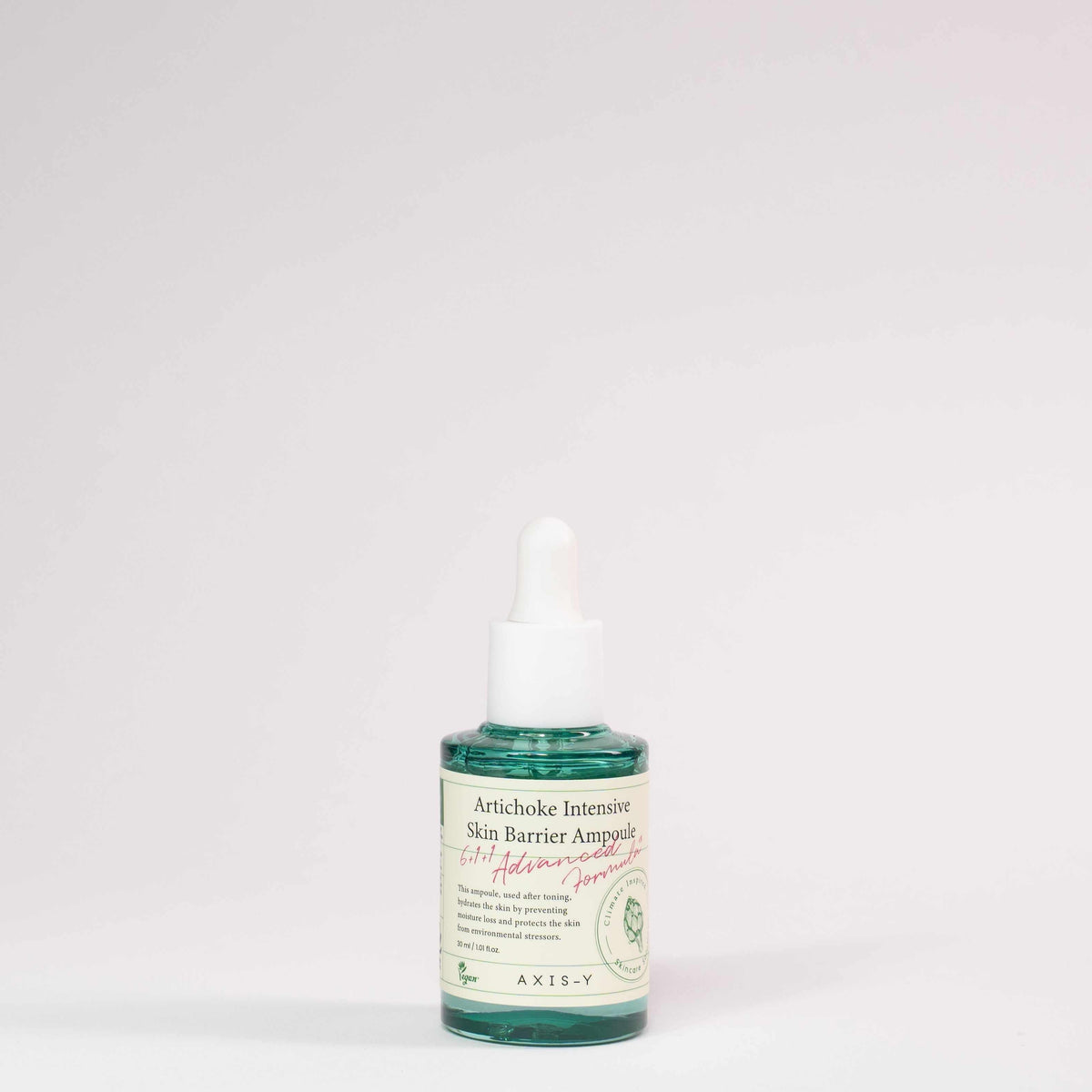 Ampolla Artichoke intensive skin barrier in vetro verde, con contagocce bianco ed etichetta crema con dettagli botanici.