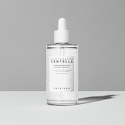 Ampolla viso Tonico Brightening trasparente in vetro con contagocce bianco e formula con capsule visibili